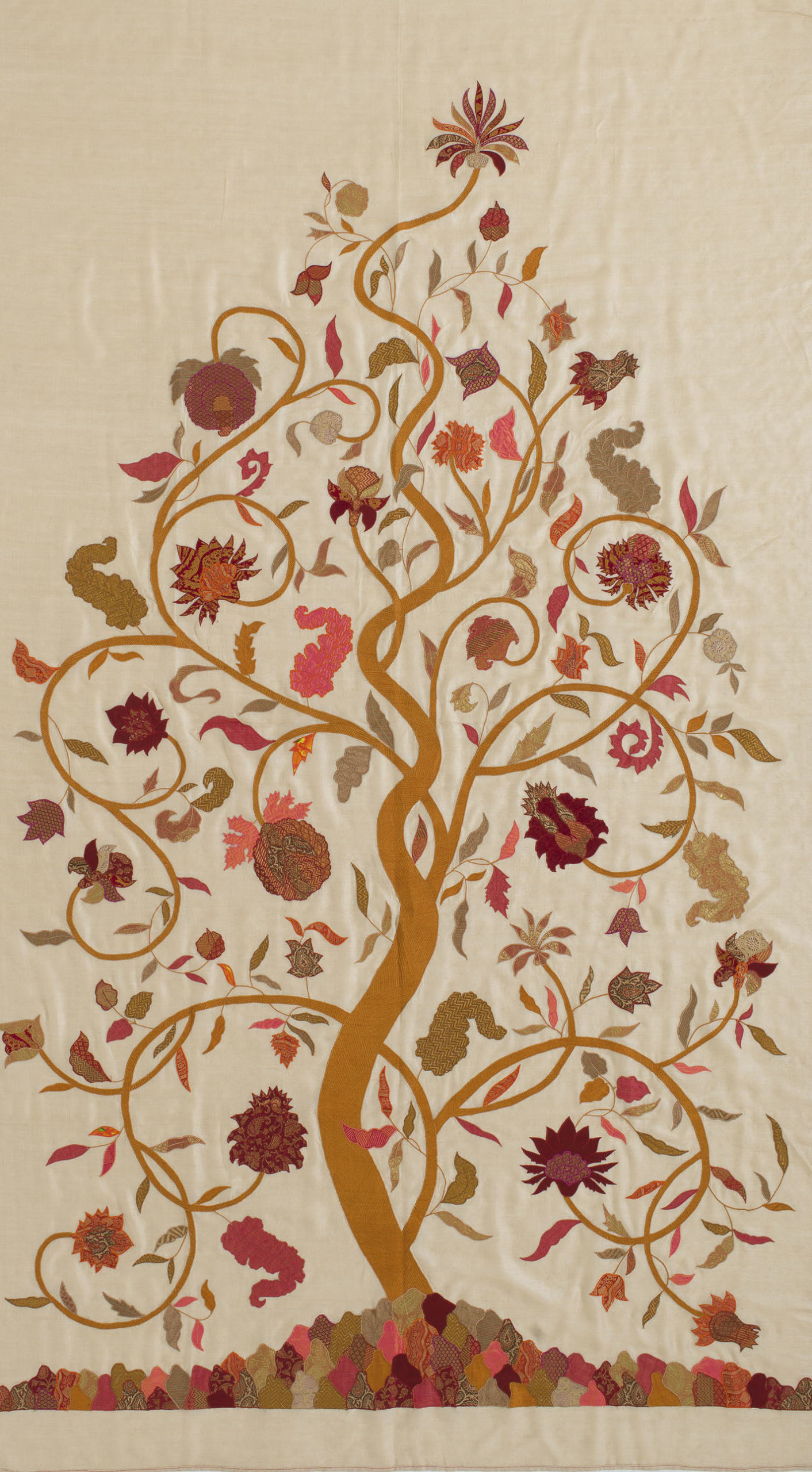 A textile featuring a tree of life motif bearing fruits, leaves and flowers.