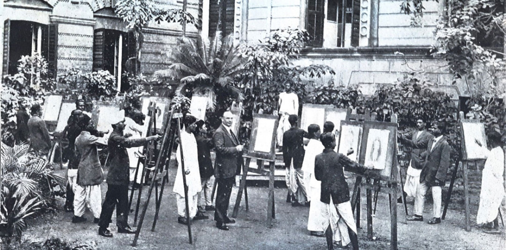 A group of male students stand in a garden and sketch on easel-supported canvases facing a male model on a pedestal in the background.