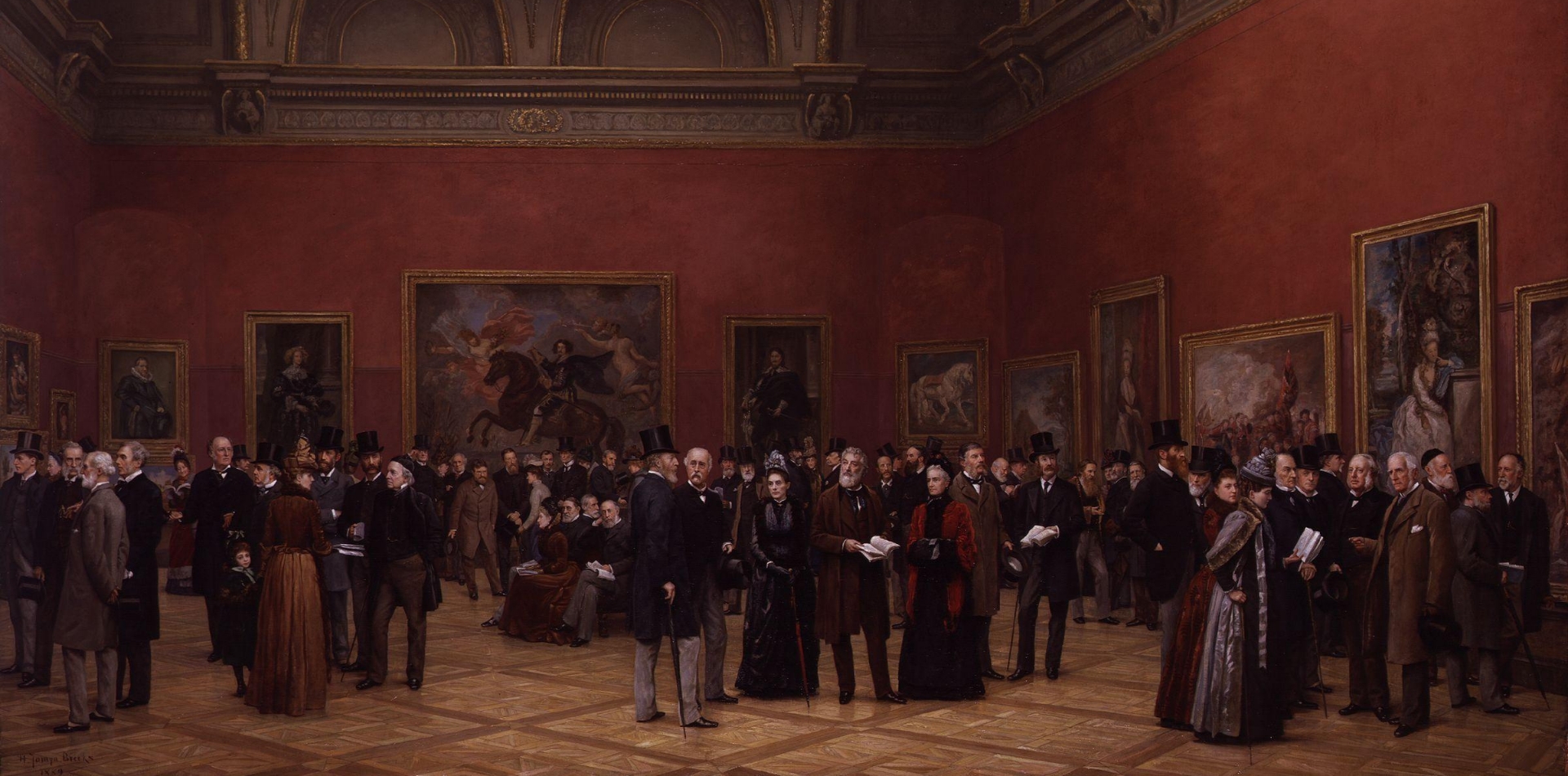 A group of men and women in formal attire engage in conversation while admiring large paintings hung on the red walls of an exhibition hall.
