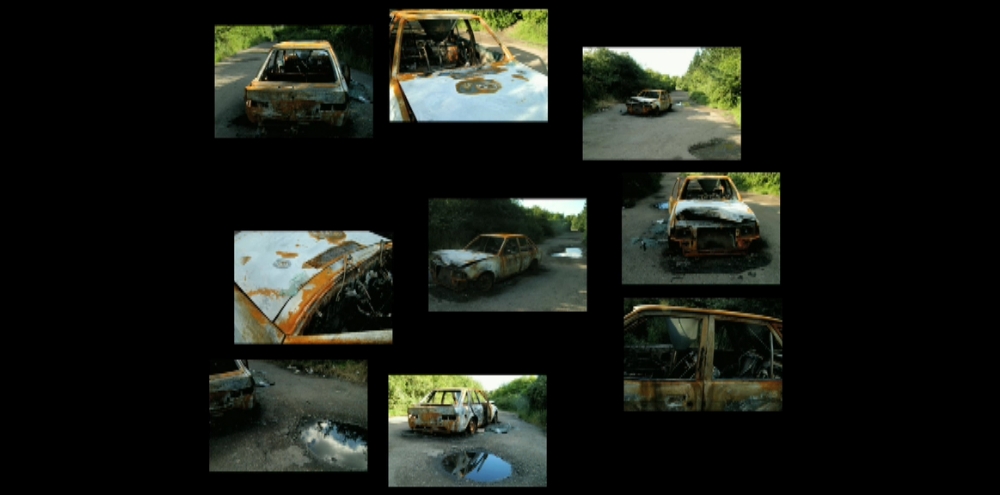 A film screengrab shows a photographic collage featuring various angles of a rusted abandoned car in the middle of a street.