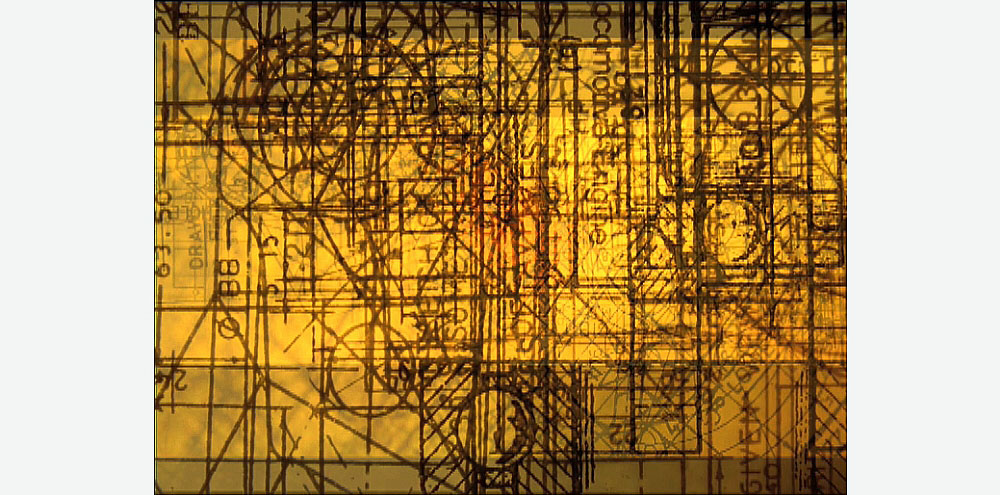 A film screengrab of superimposed black text over several shapes and lines on a bright yellow background.